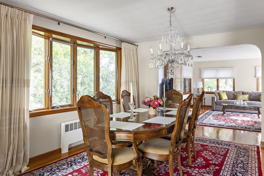 156 Woodcliff Road Newton, MA 02461 - Photo 5 of 17 a dining room with furniture a chandelier and wooden floor