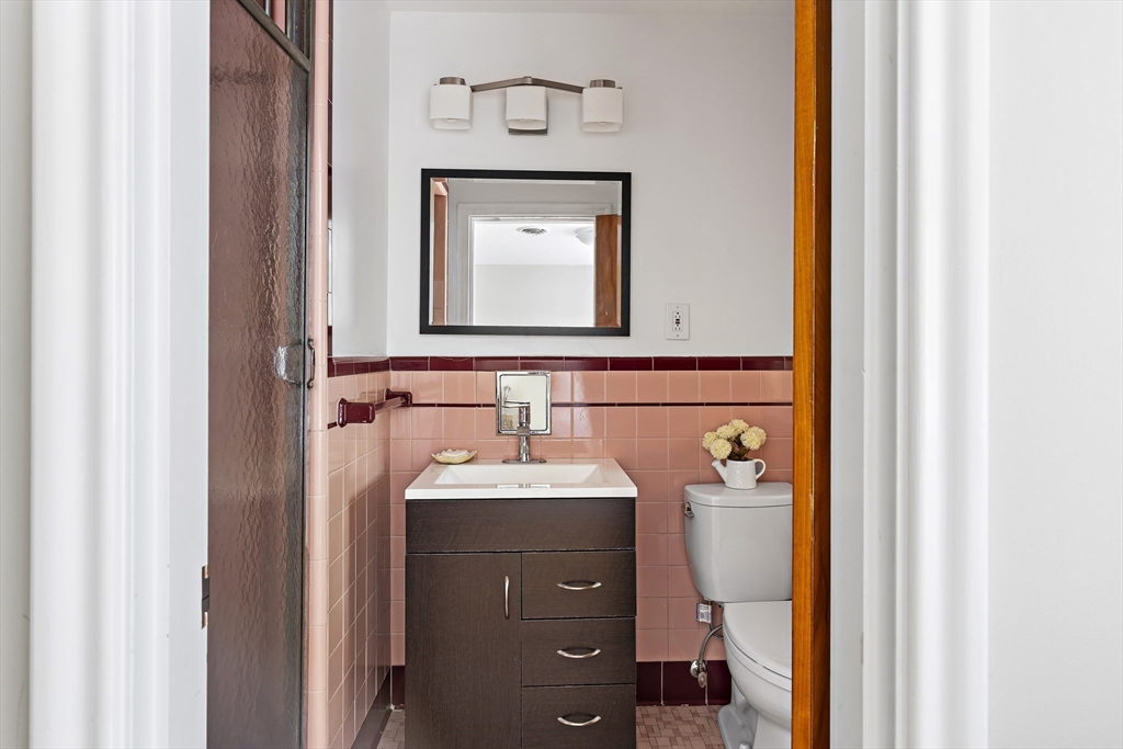 156 Woodcliff Road Newton, MA 02461 - Photo 9 of 17 a bathroom with a sink and a mirror