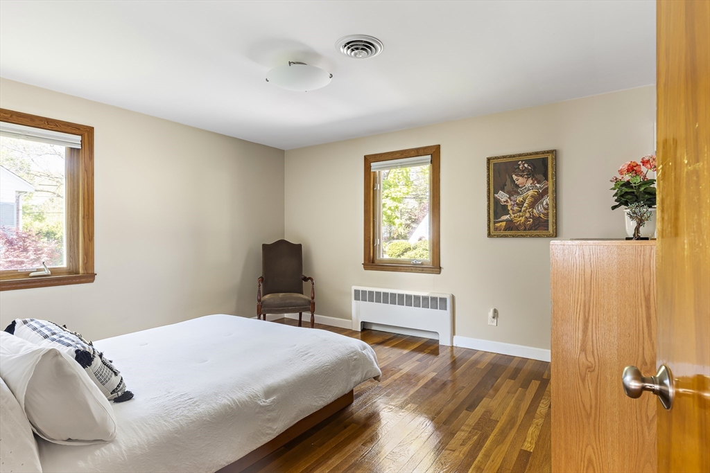 156 Woodcliff Road Newton, MA 02461 - Photo 10 of 17 a bedroom with a bed and wooden floor