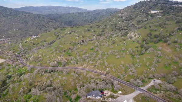 a view of a dry yard with mountain
