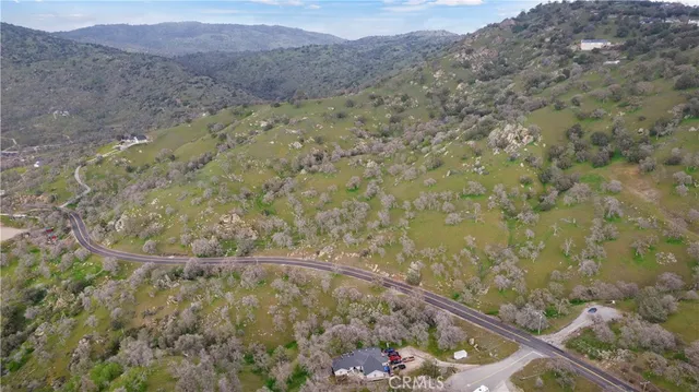 a view of a dry yard with mountain