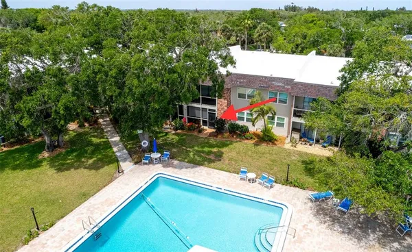 a view of a house with a yard and patio
