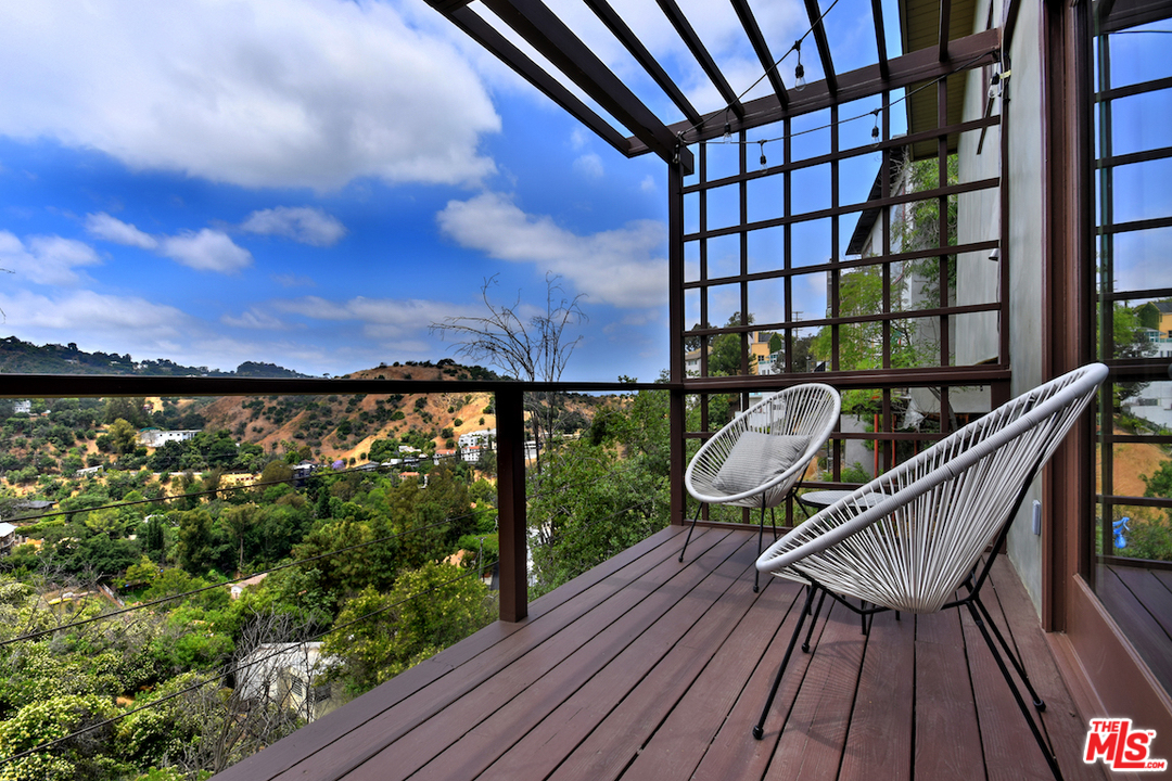 3605 Alta Mesa Drive Studio City, CA 91604 - Photo 29 of 47 a view of a balcony with wooden floor and city view