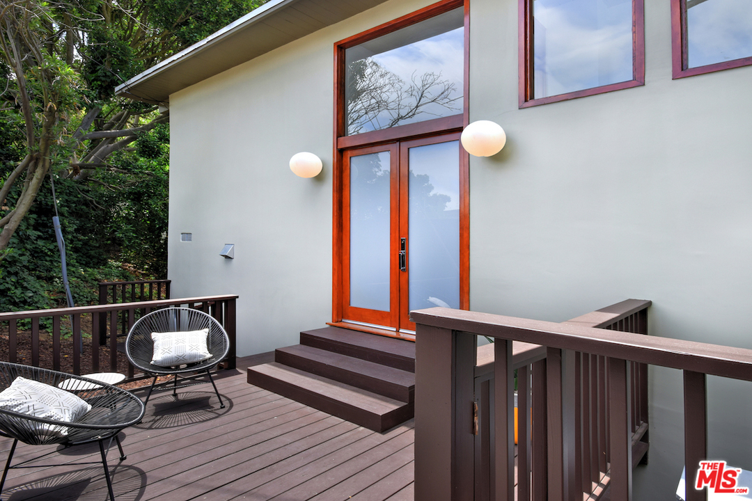 3605 Alta Mesa Drive Studio City, CA 91604 - Photo 4 of 47 a view of a balcony with furniture and wooden floor