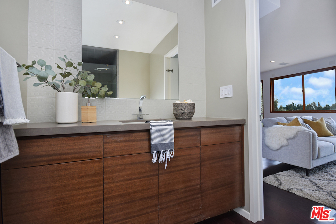 3605 Alta Mesa Drive Studio City, CA 91604 - Photo 34 of 47 a bathroom with a sink and a mirror