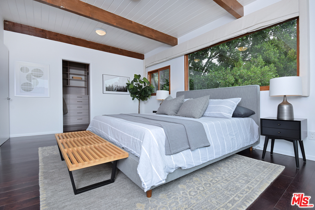 3605 Alta Mesa Drive Studio City, CA 91604 - Photo 38 of 47 a bedroom with a bed lamp and a large window