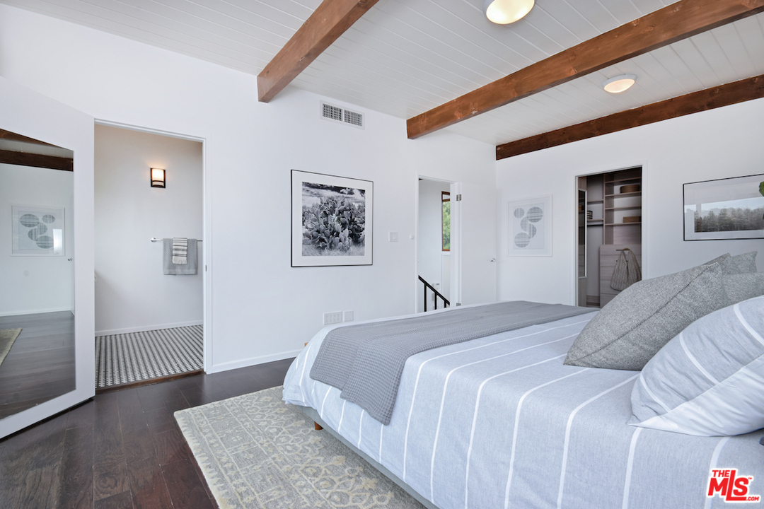 3605 Alta Mesa Drive Studio City, CA 91604 - Photo 41 of 47 a bedroom with a large bed and a walk in closet