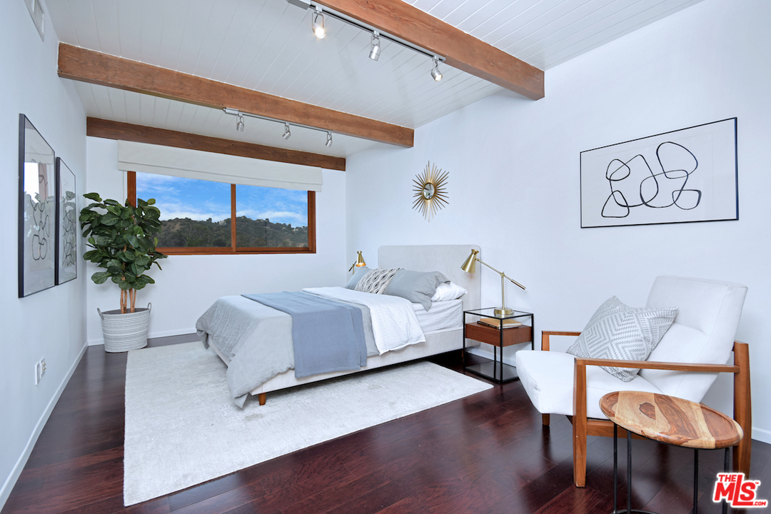 3605 Alta Mesa Drive Studio City, CA 91604 - Photo 45 of 47 a bedroom with furniture and a potted plant