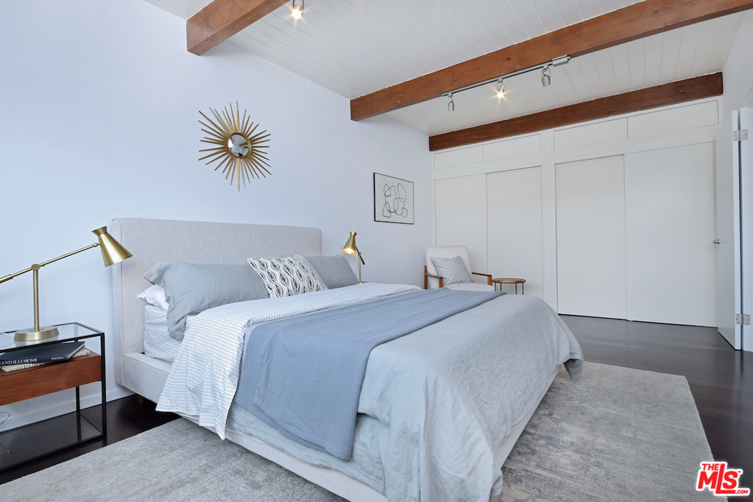 3605 Alta Mesa Drive Studio City, CA 91604 - Photo 46 of 47 a bed room with a bed and a chandelier