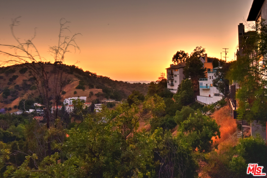 3605 Alta Mesa Drive Studio City, CA 91604 - Photo 47 of 47 a view of a house with a mountain in the background