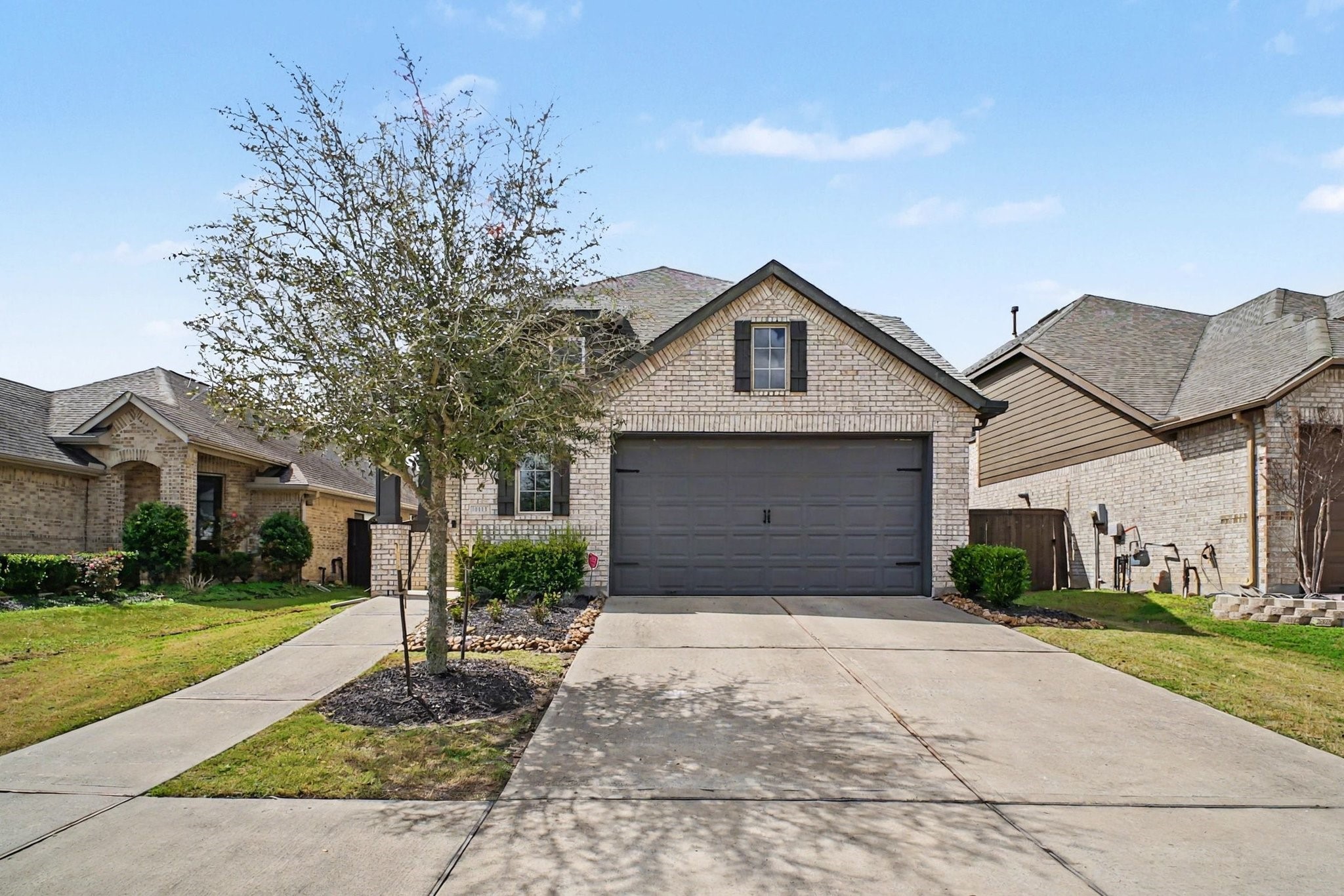 10602 Wagner Street Rosharon, TX 77583 - Photo 1 of 35 a front view of a house with a yard and garage