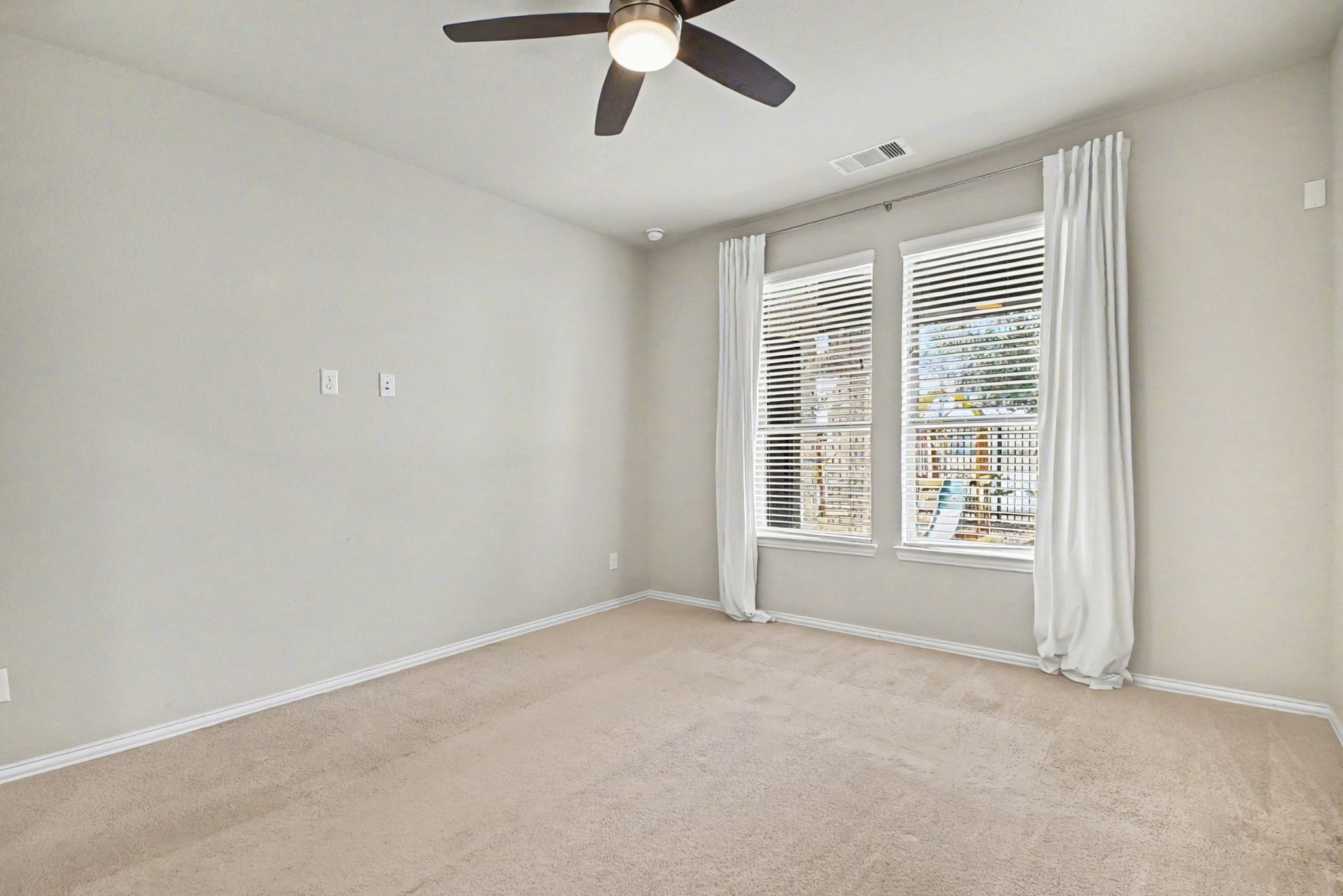 10602 Wagner Street Rosharon, TX 77583 - Photo 11 of 35 a view of an empty room with a window