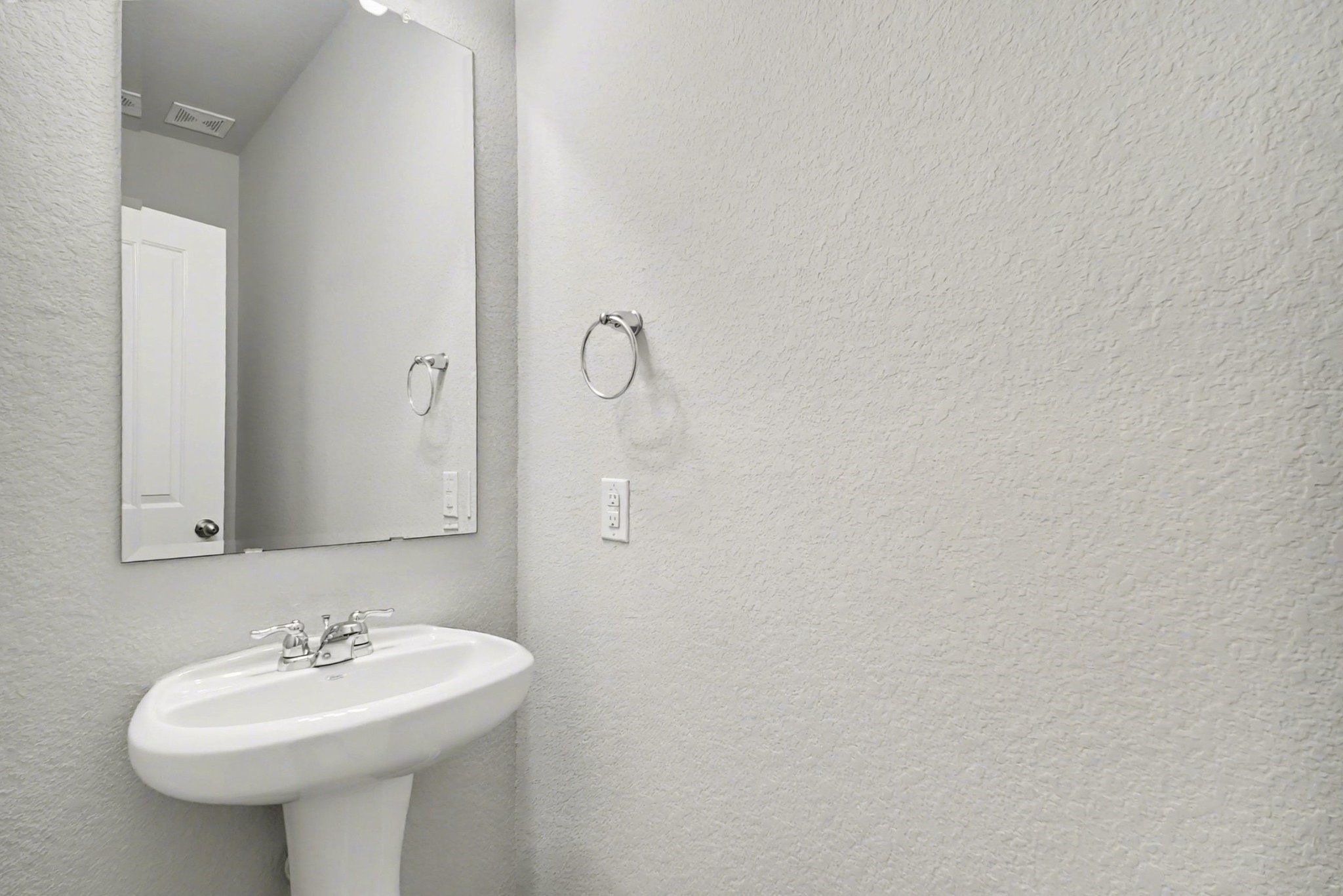 10602 Wagner Street Rosharon, TX 77583 - Photo 20 of 35 a bathroom with a sink and a mirror