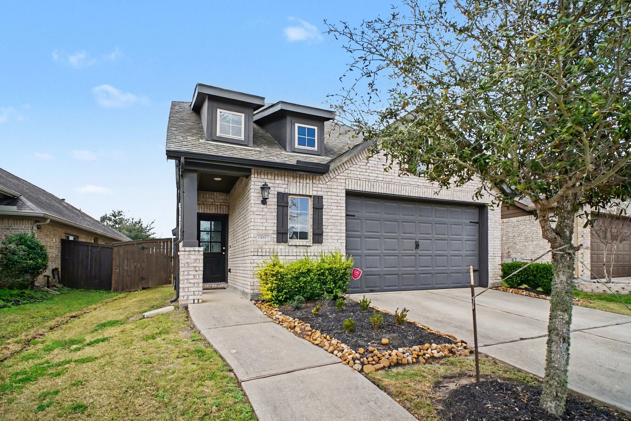 10602 Wagner Street Rosharon, TX 77583 - Photo 2 of 35 a front view of a house with a yard