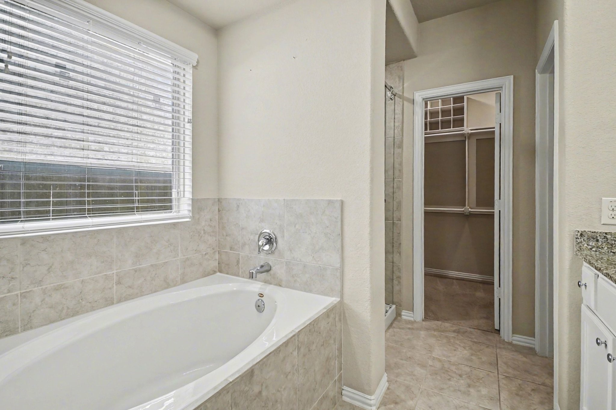 10602 Wagner Street Rosharon, TX 77583 - Photo 26 of 35 a bathroom with a bathtub and a shower