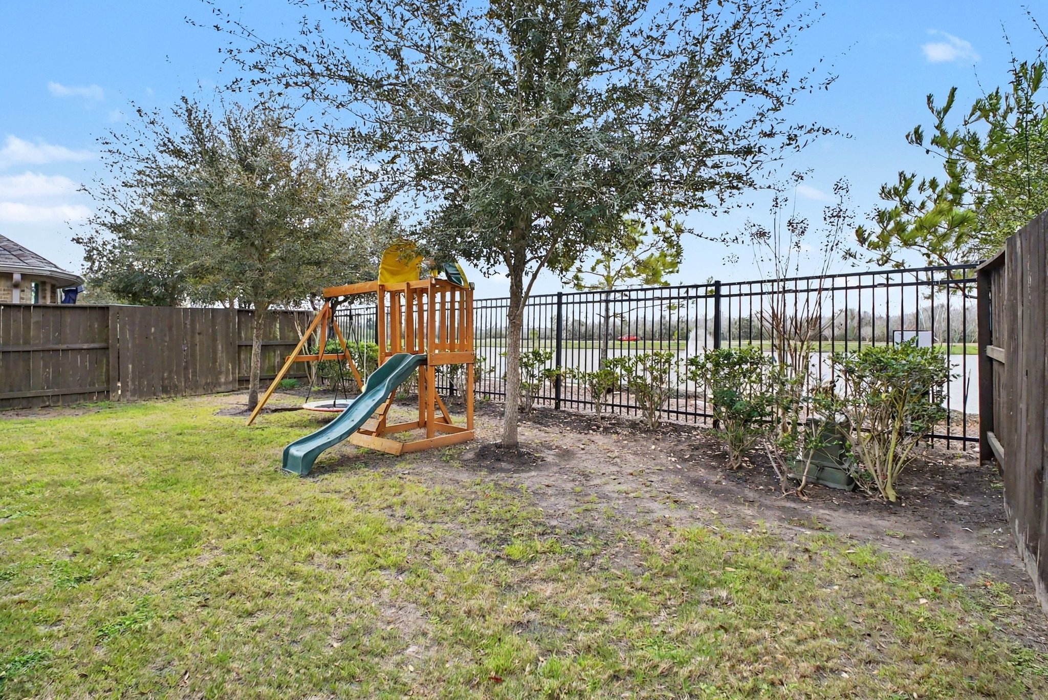 10602 Wagner Street Rosharon, TX 77583 - Photo 34 of 35 a view of a yard with a slide trees
