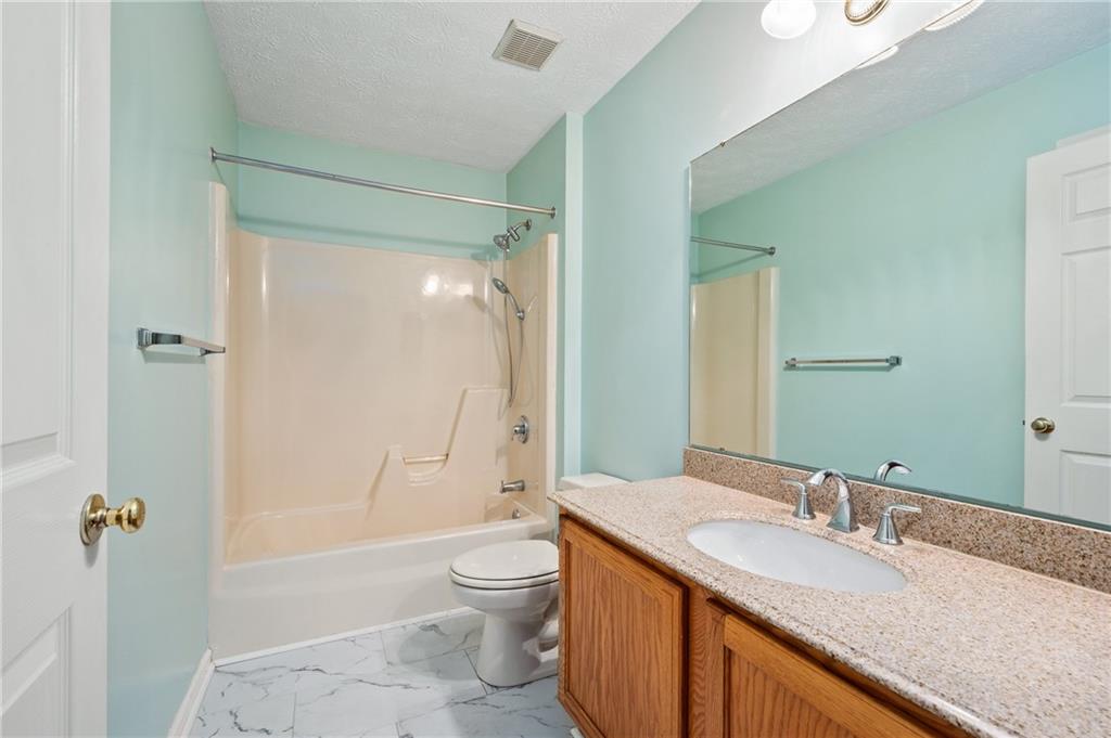 522 Leland Drive Pittsburgh, PA 15236 - Photo 14 of 22 a bathroom with a granite countertop sink toilet and shower