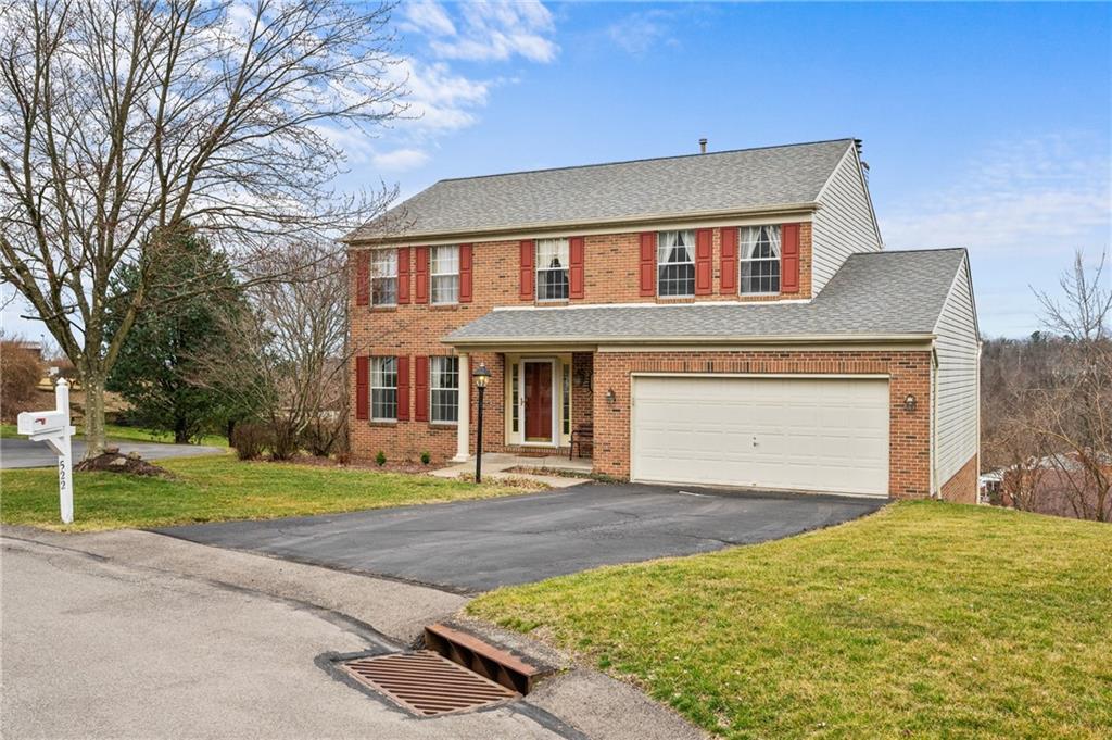 522 Leland Drive Pittsburgh, PA 15236 - Photo 2 of 22 a front view of a house with a yard and garage