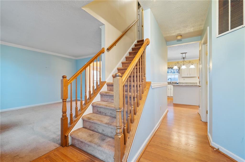 522 Leland Drive Pittsburgh, PA 15236 - Photo 3 of 22 a view of a hallway with wooden floor and staircase