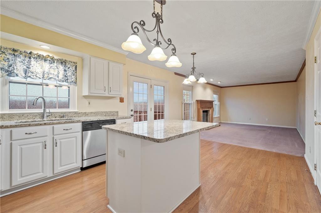 522 Leland Drive Pittsburgh, PA 15236 - Photo 7 of 22 a kitchen with granite countertop a sink cabinets and wooden floor
