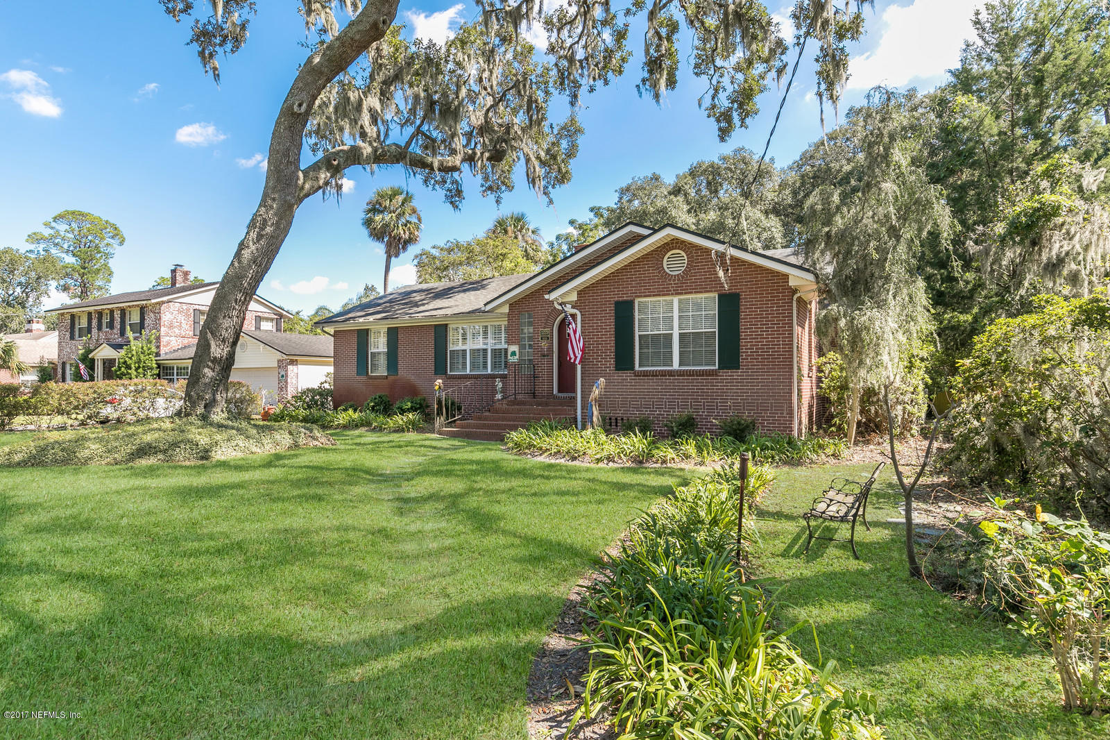 1229 Nicholson Road Jacksonville, FL 32207 - Photo 1 of 29 a front view of a house with a garden