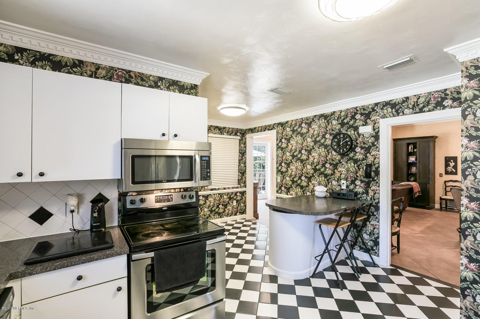 1229 Nicholson Road Jacksonville, FL 32207 - Photo 14 of 29 a kitchen with a sink a stove and cabinets
