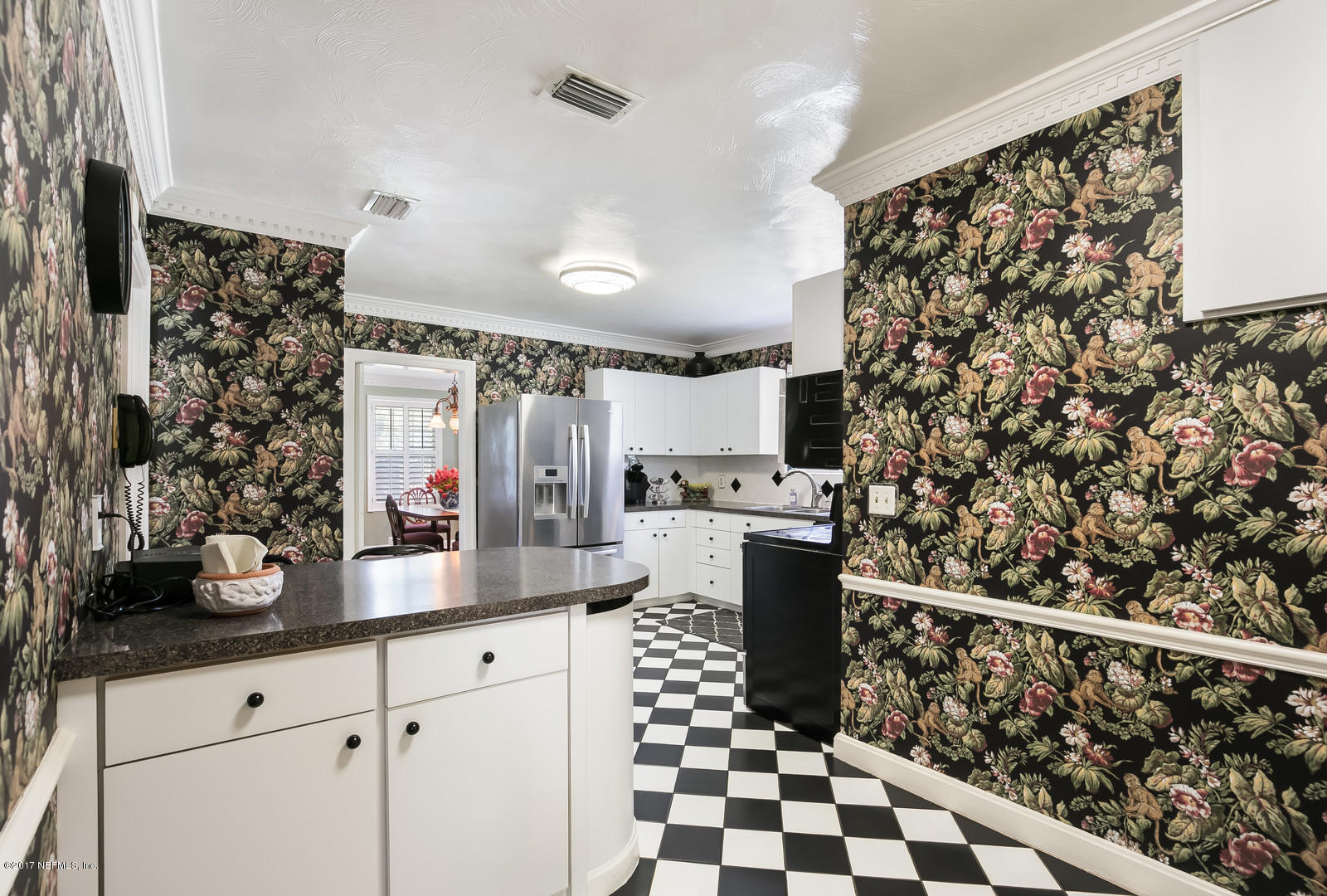 1229 Nicholson Road Jacksonville, FL 32207 - Photo 16 of 29 a kitchen with granite countertop a refrigerator and a sink