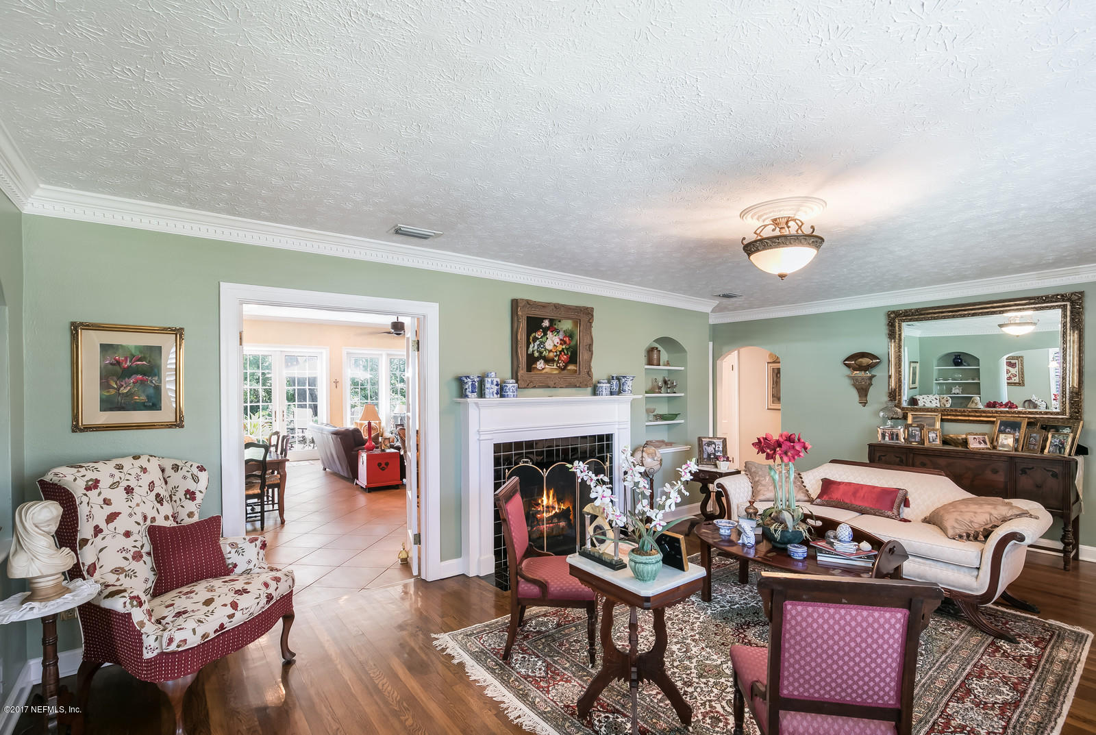 1229 Nicholson Road Jacksonville, FL 32207 - Photo 5 of 29 a living room with fireplace furniture and a fireplace
