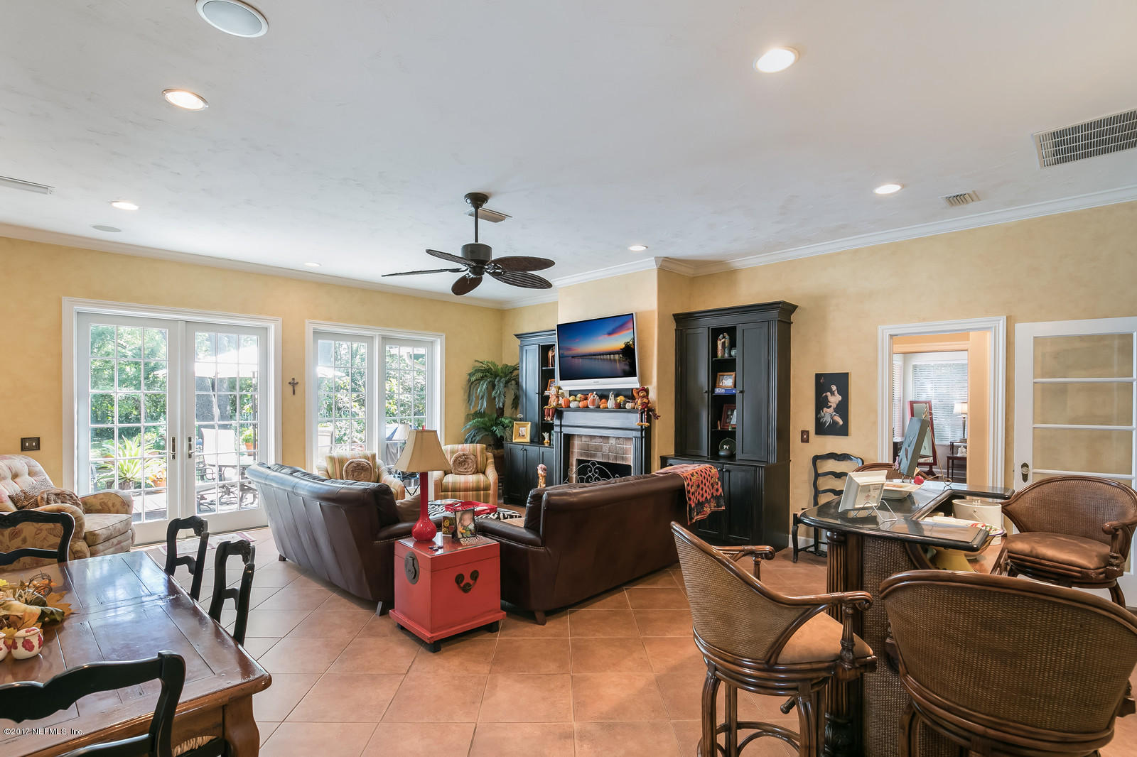 1229 Nicholson Road Jacksonville, FL 32207 - Photo 9 of 29 a living room with fireplace furniture and a large window