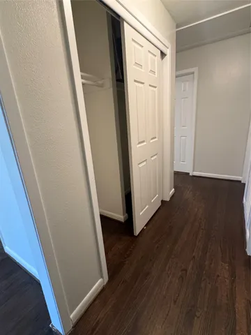 a view of front door with wooden floor