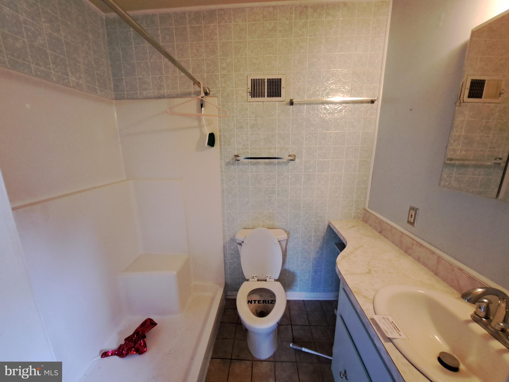 1371 Lower Ferry Road Ewing, NJ 08618 - Photo 11 of 18 a bathroom with a sink toilet and shower