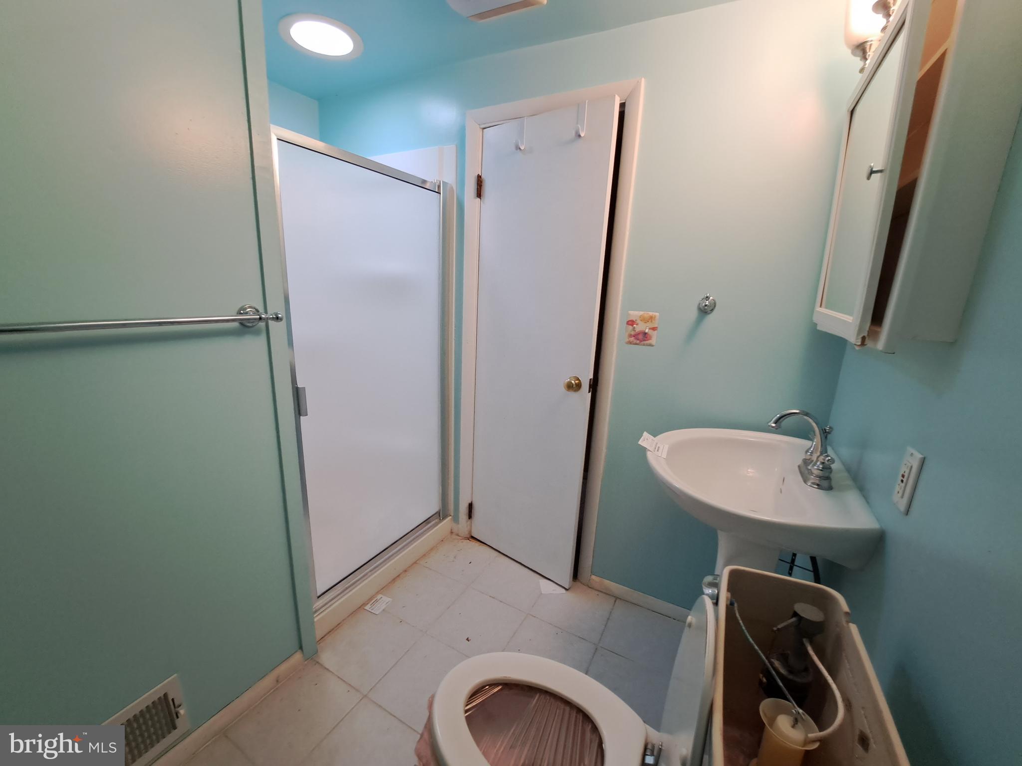 1371 Lower Ferry Road Ewing, NJ 08618 - Photo 14 of 18 a bathroom with a sink a toilet a mirror and shower