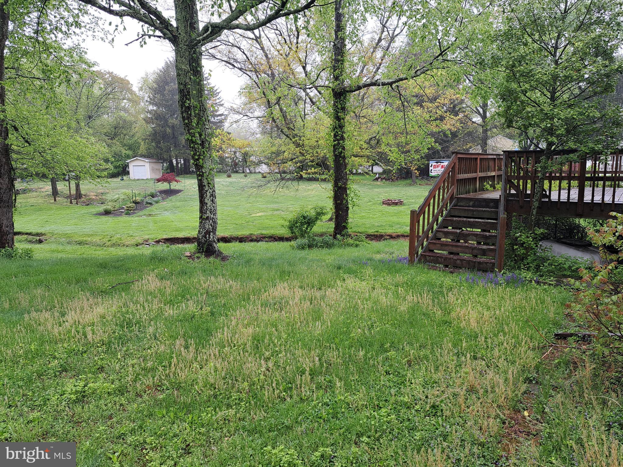 1371 Lower Ferry Road Ewing, NJ 08618 - Photo 17 of 18 a view of a garden with trees