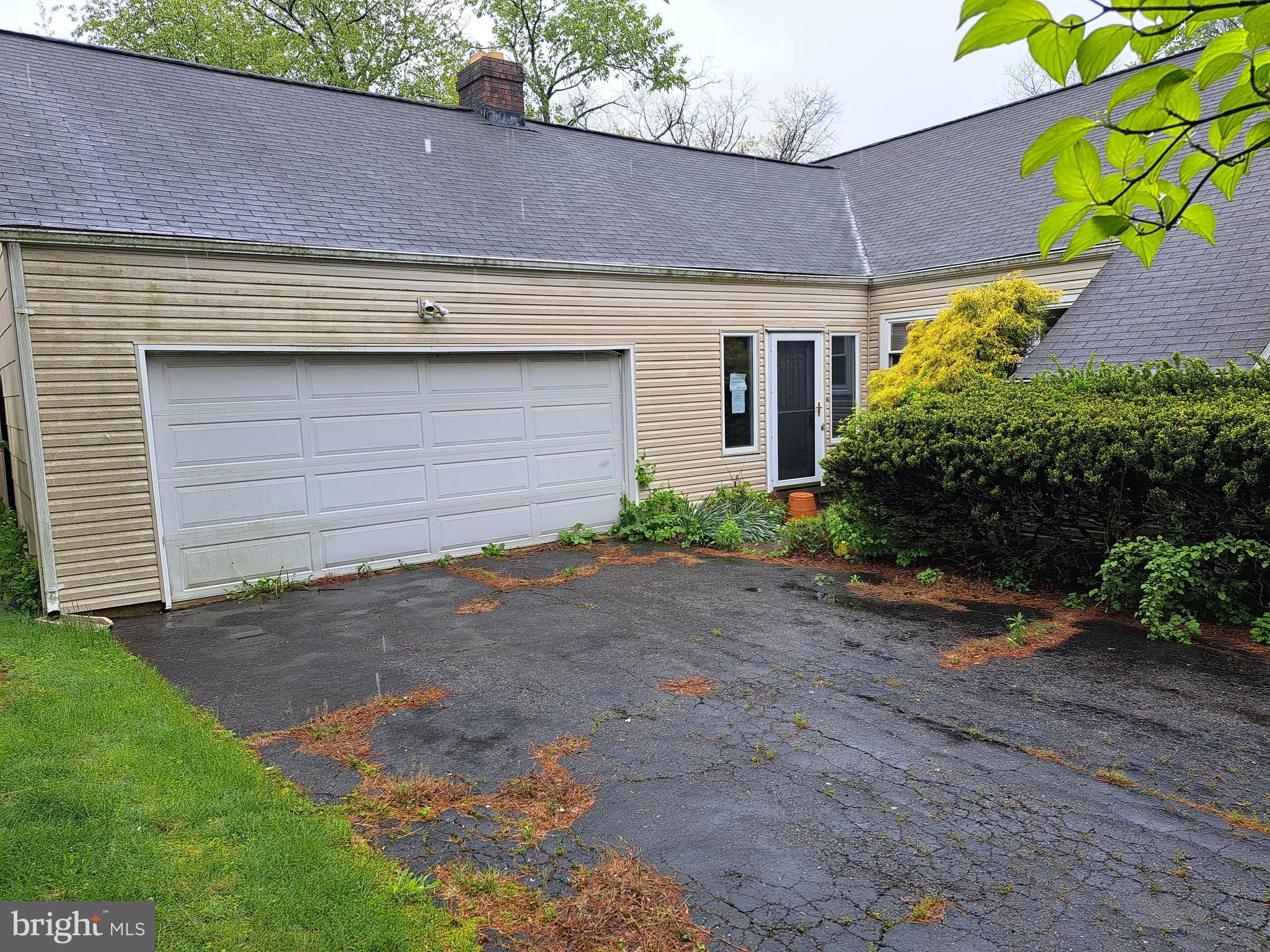 1371 Lower Ferry Road Ewing, NJ 08618 - Photo 2 of 18 a front view of a house with a yard and garage