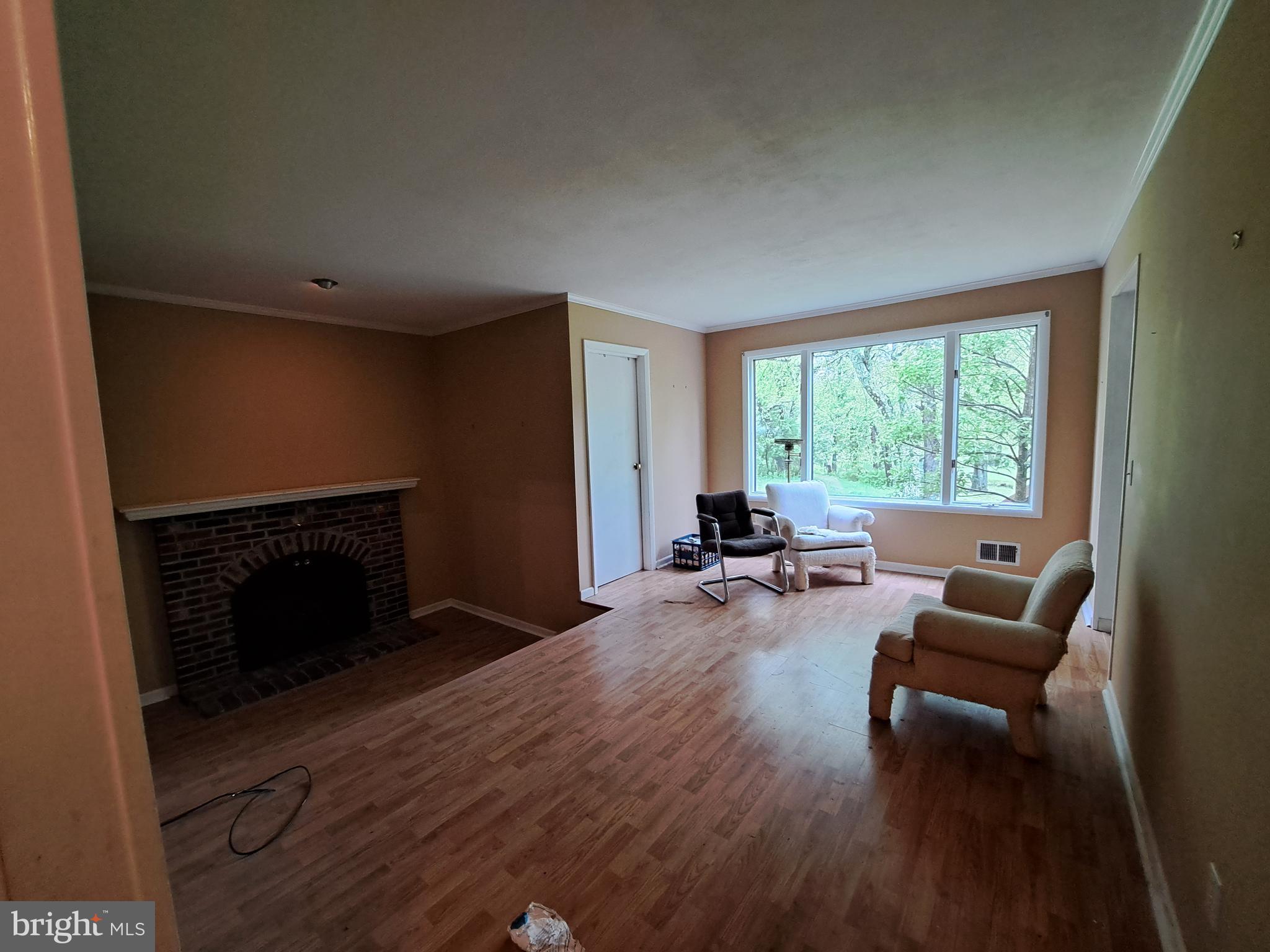1371 Lower Ferry Road Ewing, NJ 08618 - Photo 6 of 18 a living room with furniture and a fireplace
