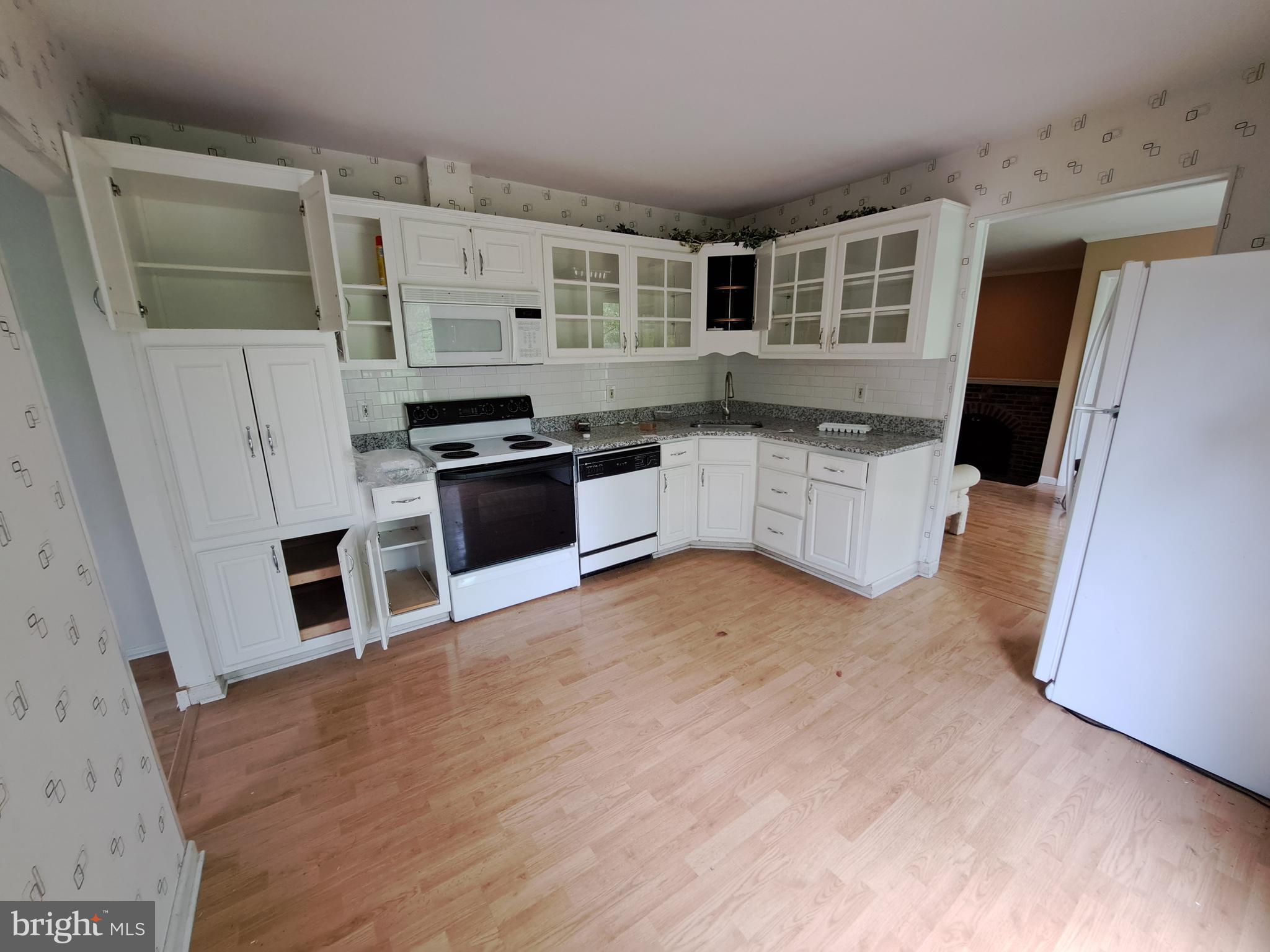 1371 Lower Ferry Road Ewing, NJ 08618 - Photo 7 of 18 a kitchen with stainless steel appliances granite countertop a refrigerator a stove top oven a sink and dishwasher