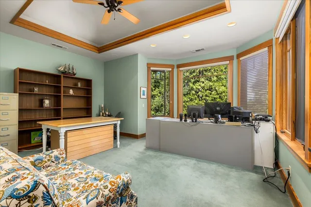 a spacious bedroom with a bed and a window