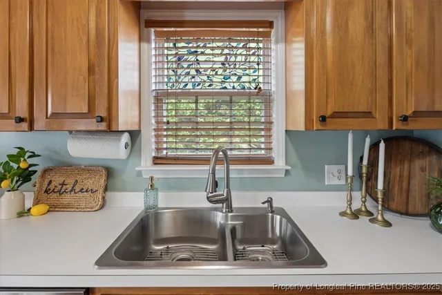 a kitchen with stainless steel appliances granite countertop a refrigerator and a stove