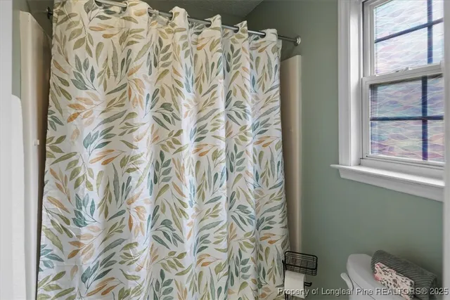 a house that has a big yard and a large tree