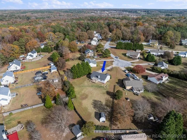 an aerial view of residential house with outdoor space