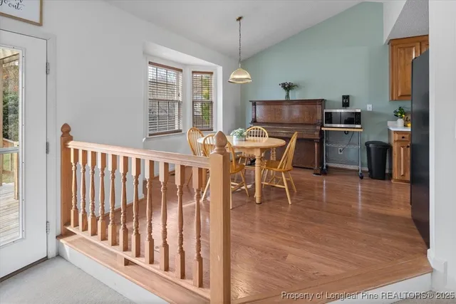 a view of a dining room with furniture window and wooden floor