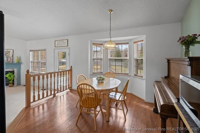 a kitchen with stainless steel appliances granite countertop a refrigerator a stove a sink and a microwave