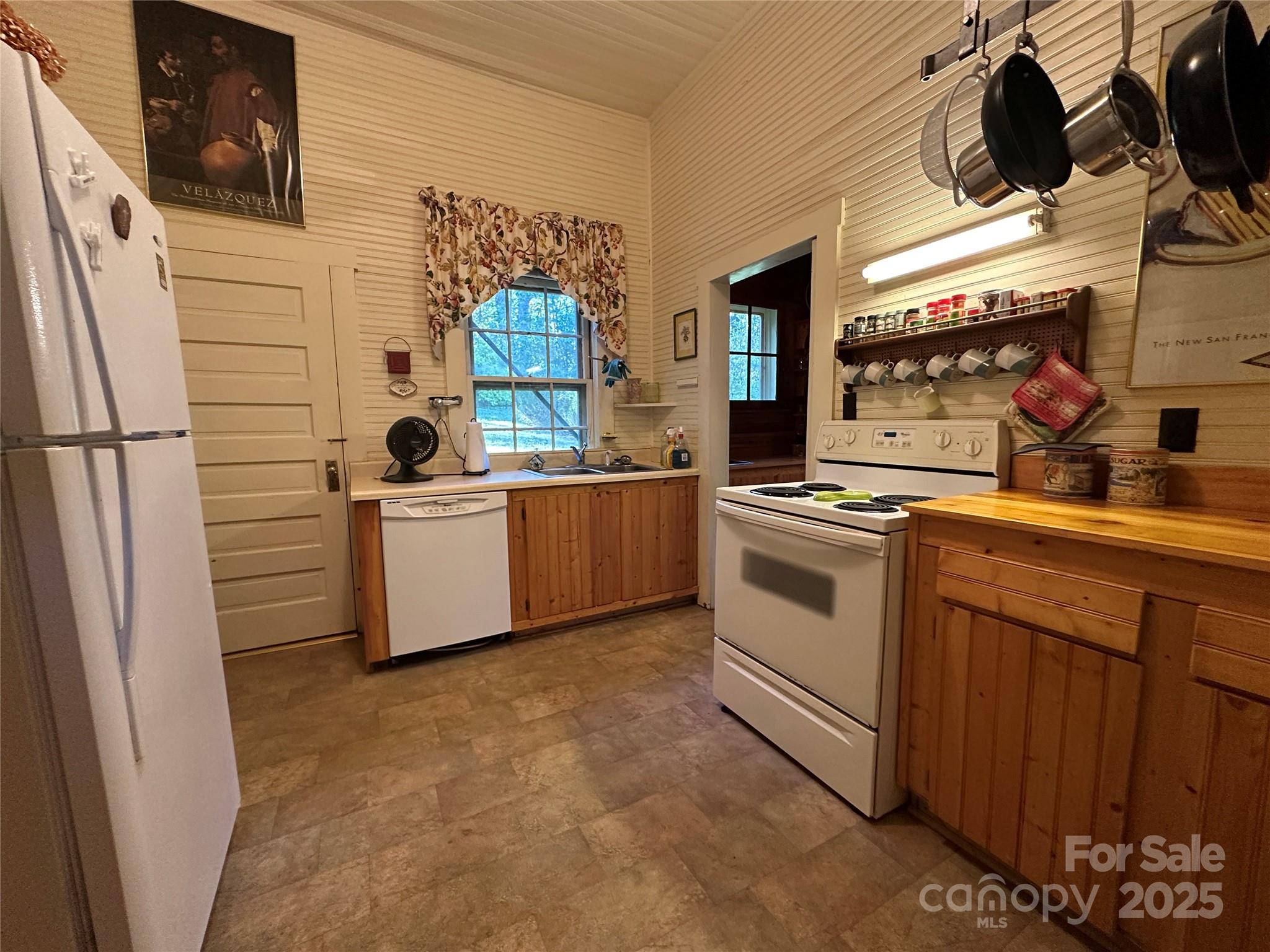 16 Osborn Knob Road Marion, NC 28752 - Photo 24 of 48 a kitchen with stainless steel appliances a refrigerator and a stove top oven