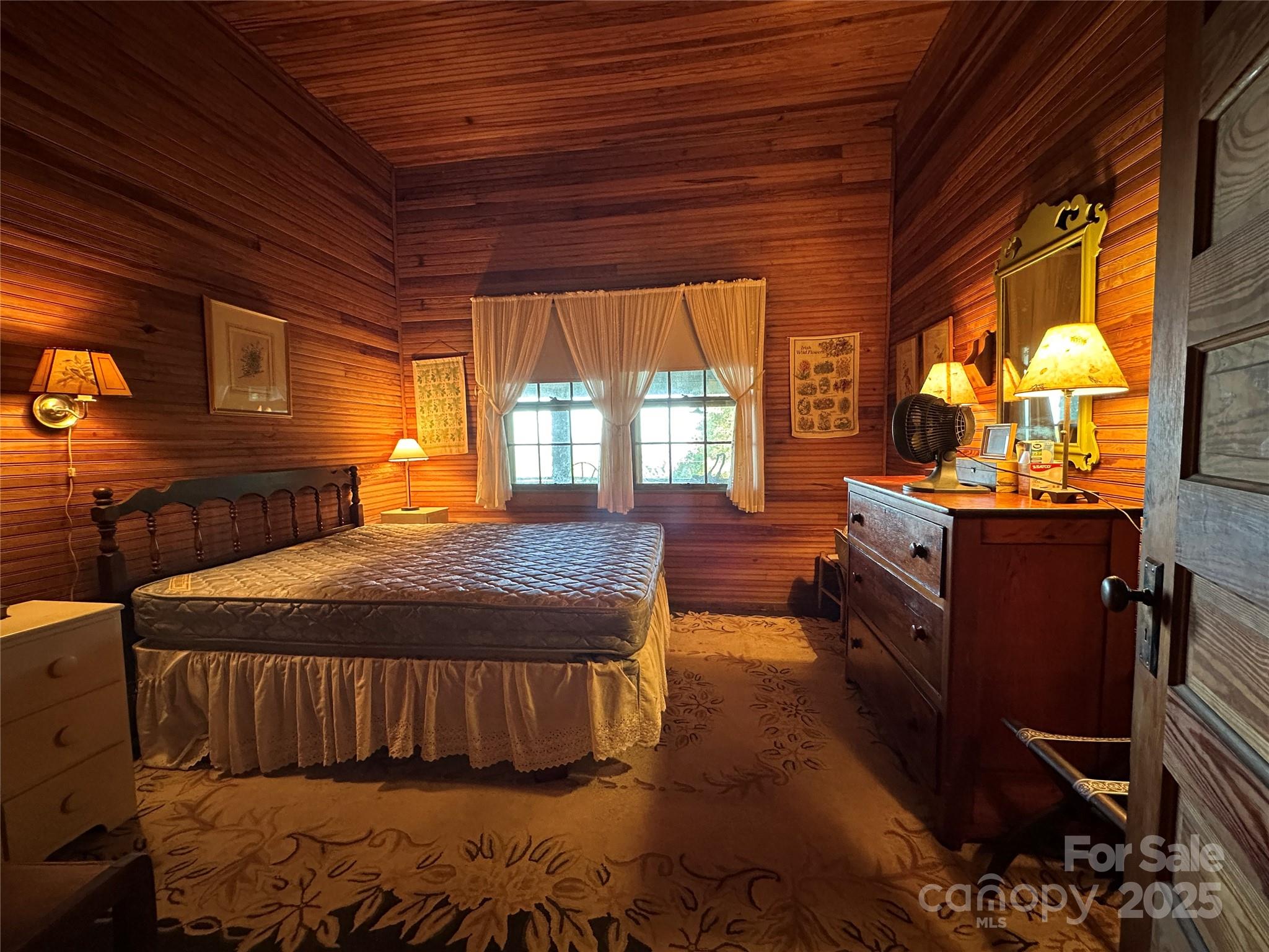 16 Osborn Knob Road Marion, NC 28752 - Photo 27 of 48 a bed sitting in a bedroom next to a window