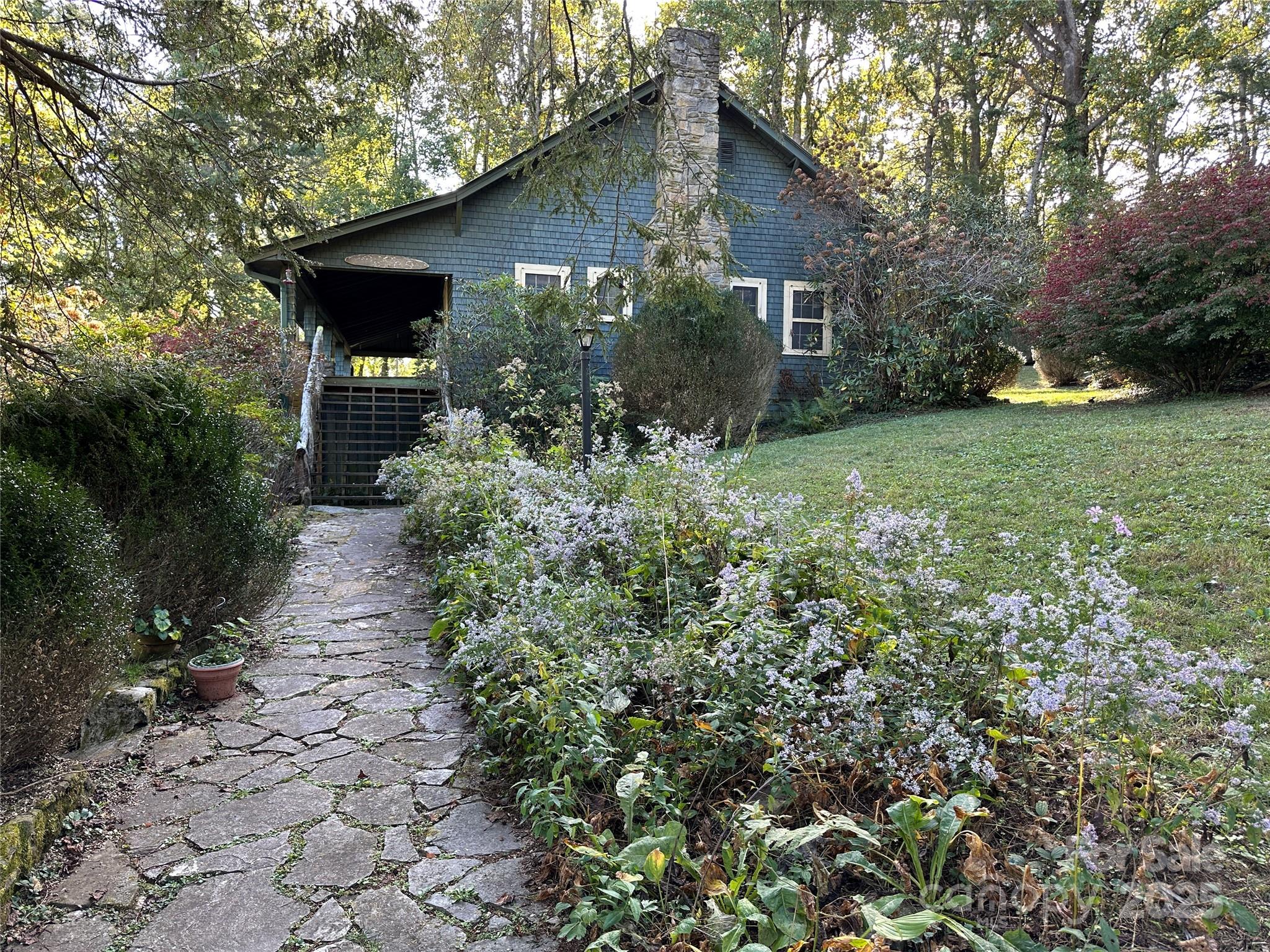 16 Osborn Knob Road Marion, NC 28752 - Photo 3 of 48 a front view of a house with garden