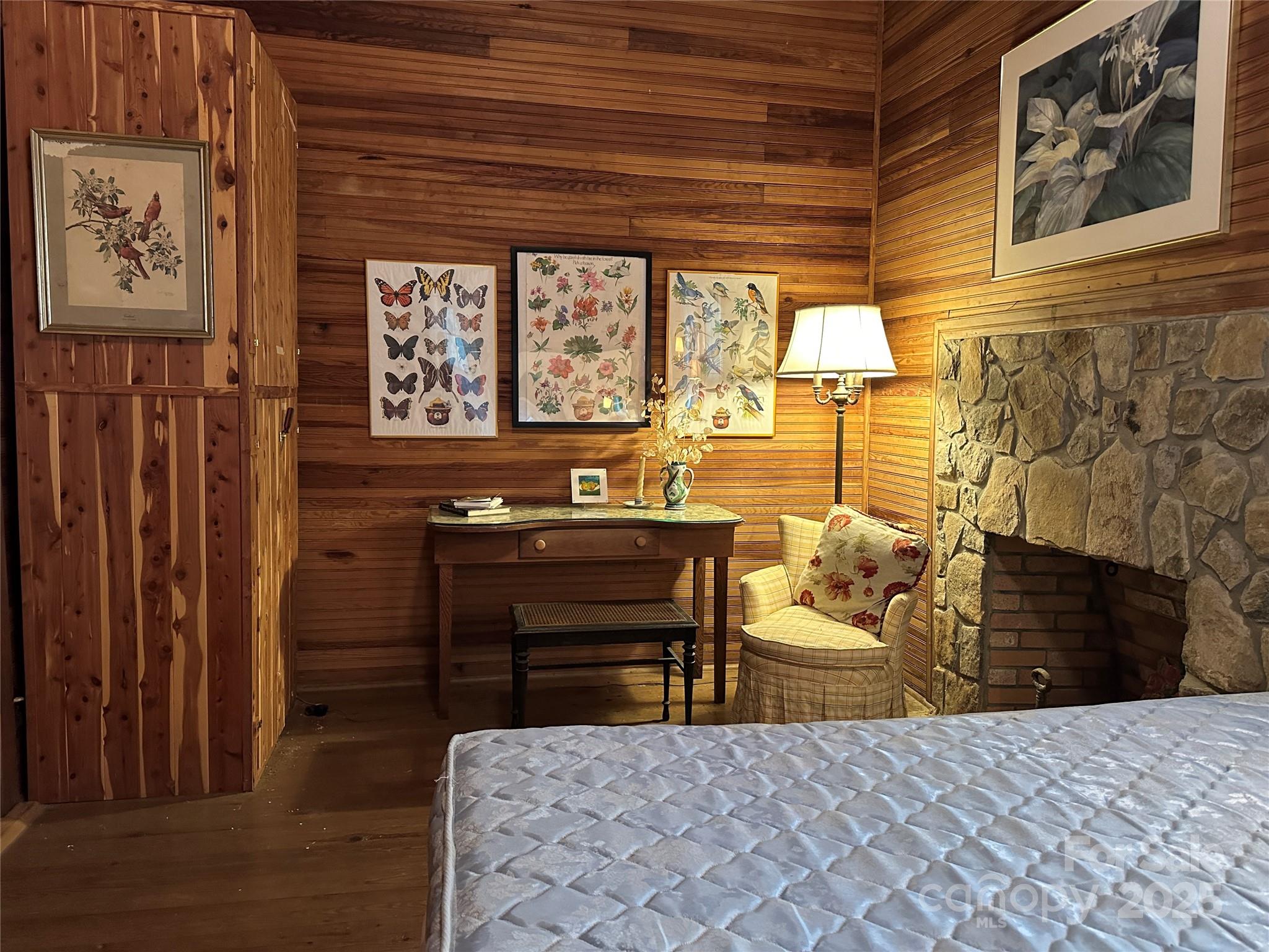 16 Osborn Knob Road Marion, NC 28752 - Photo 36 of 48 a bedroom with a bed and wooden floor