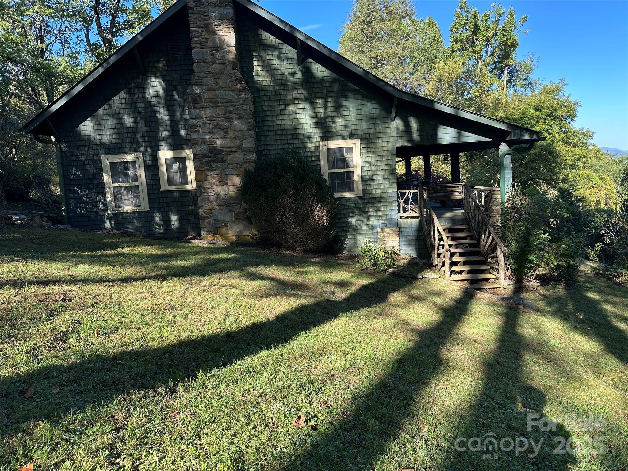 16 Osborn Knob Road Marion, NC 28752 - Photo 4 of 48 a view of a house with backyard and sitting area