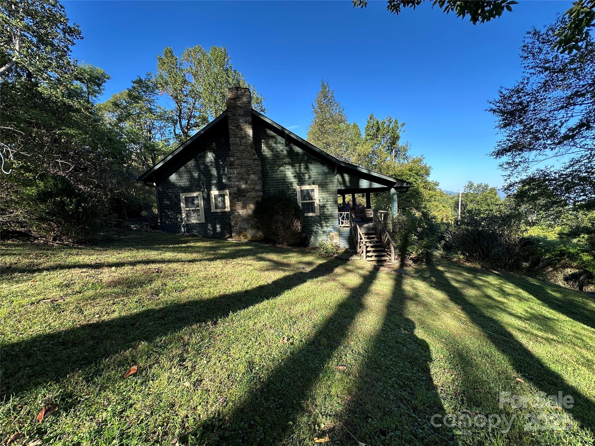 16 Osborn Knob Road Marion, NC 28752 - Photo 6 of 48 a view of swimming pool with lawn chairs and plants