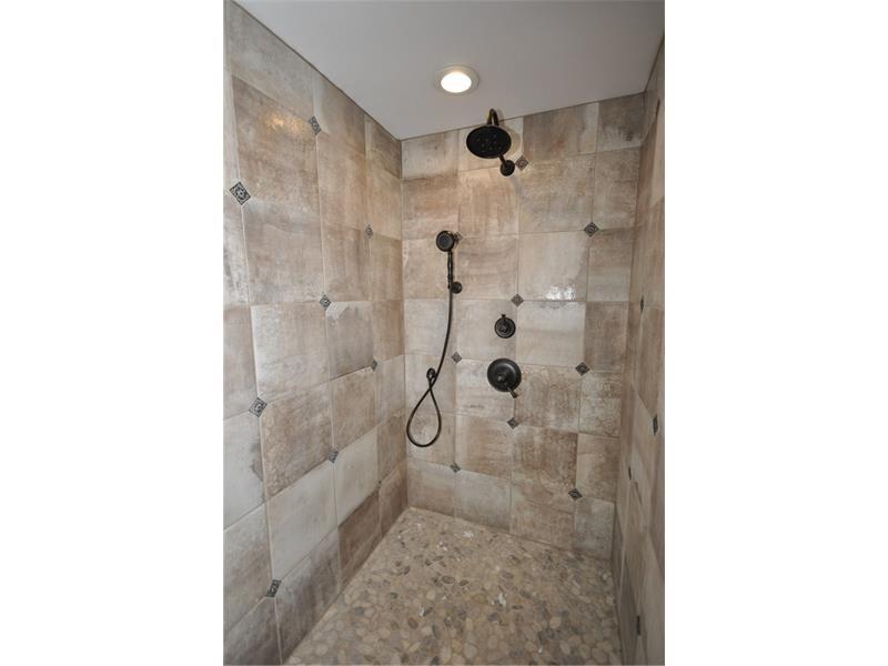214 Highland Road Pittsburgh, PA 15238 - Photo 14 of 23 Beautiful marble walk in shower with multiple shower heads is top of the line.