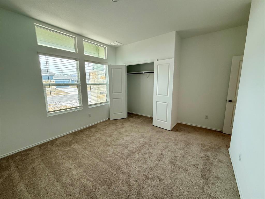 373 Jeffers Kyle, TX 78640 - Photo 14 of 26 Unfurnished bedroom featuring a closet and carpet
